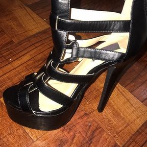 Cleopatra Stripped Under the knee high heels.